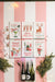 Holiday glitter towels displayed on a pink striped background