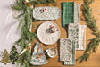 Green toile tray displayed with holiday greenery