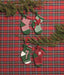 Mini knit stockings on a red tartan background