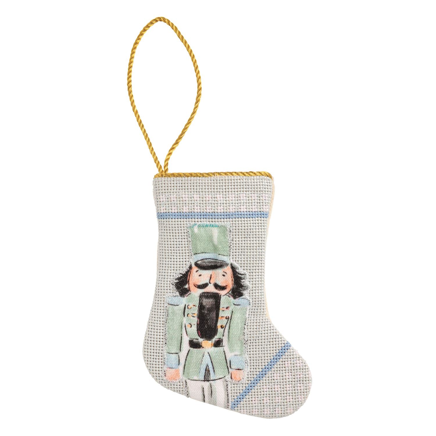 Mini needlepoint stocking with a nutcracker on a blue check background