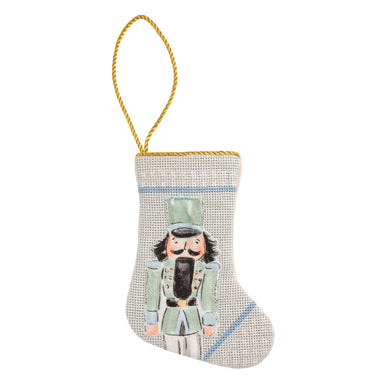 Mini needlepoint stocking with a nutcracker on a blue check background