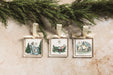 Nativity acrylic ornaments hanging with greenery