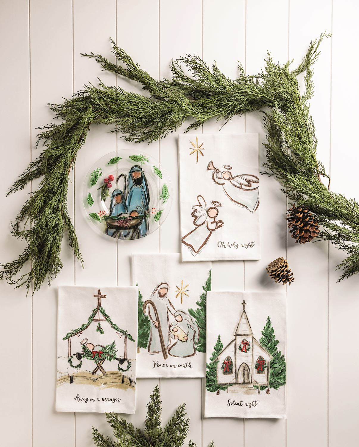 Nativity hand towels with a pine garland