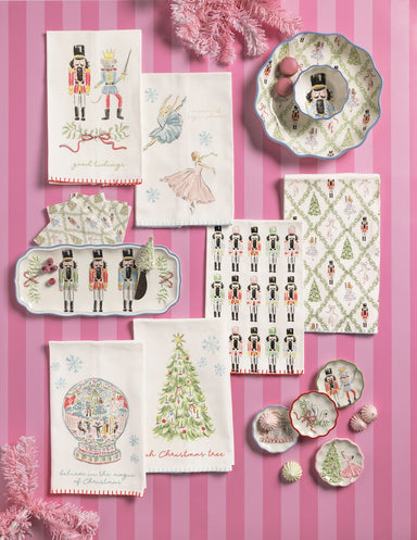 Nutcracker tray, napkins and spreader on a pink background