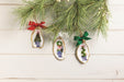 Oyster topiary ornaments on a white wood background