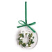 Round acrylic ornament with a painted wreath and green velvet bow