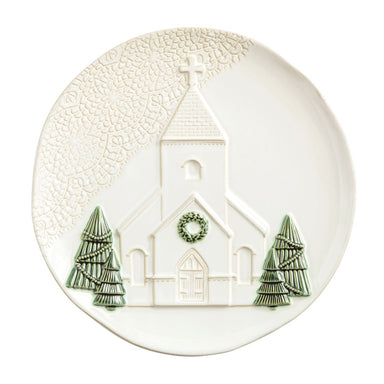 White round platter with a raised church and pressed lace border