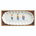 White scalloped ceramic tray with three blue and white pumpkin topiaries in a gift box