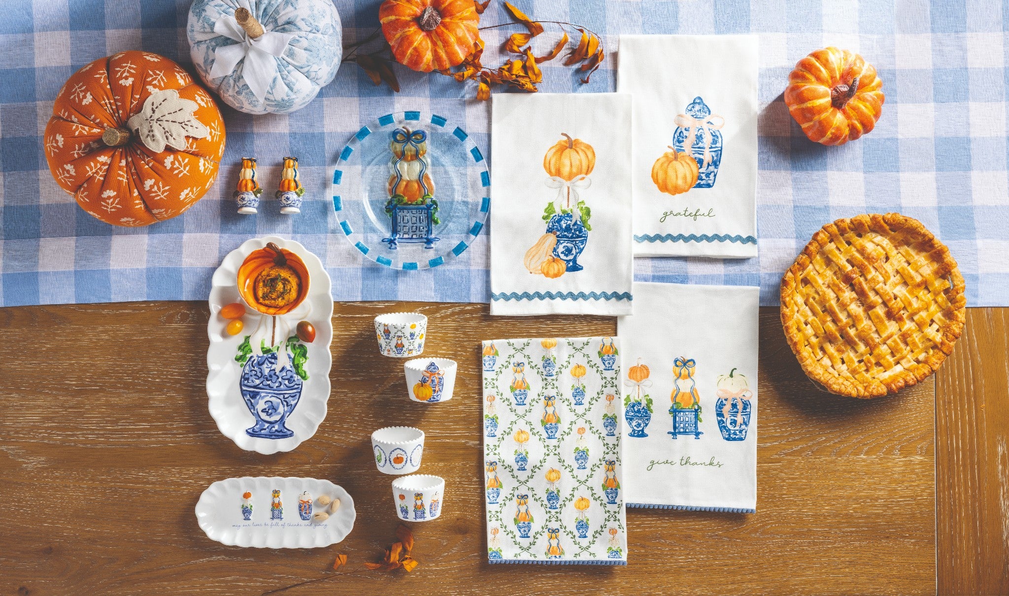 Pumpkin topiary tray and matching towels on a blue gingham tablecloth with pumpkins