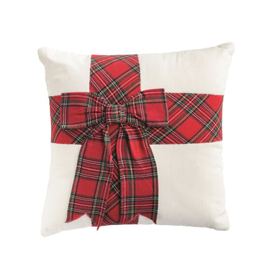 Cream velvet pillow with a red tartan bow