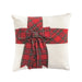 Cream velvet pillow with a red tartan bow