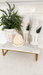 White ceramic nutcracker displayed on a shelf