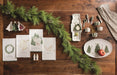 White nutcracker chip and dip on a wood table with greenery