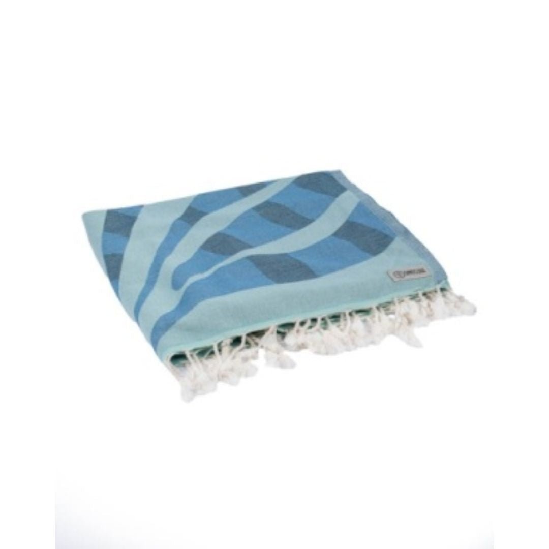 Blue patterned towel with white fringes on a white background