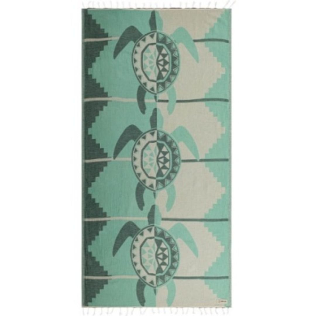 Towel with turtle and circular design on a green and beige background