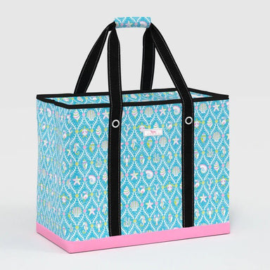 Blue patterned tote bag with black handles on a light gray background