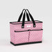 Pink patterned tote bag with black handles on a light gray background