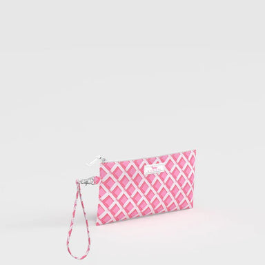 Pink and white patterned clutch with a strap on a light gray background