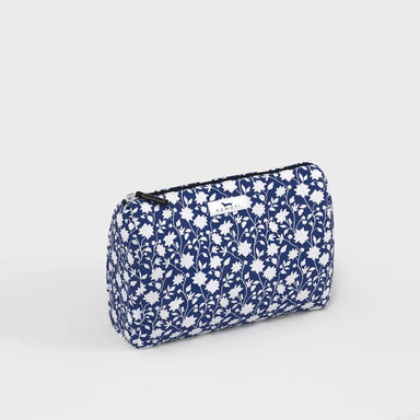 Blue floral patterned pouch on a light gray background
