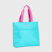 Turquoise tote bag with pink and white striped handles on a light gray background