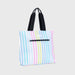Tote bag with colorful striped pattern on a light gray background