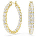 Gold Matrix crystal hoop earrings on a white background