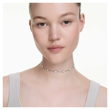 Model wearing the silver Una Angelic necklace with crystal motifs