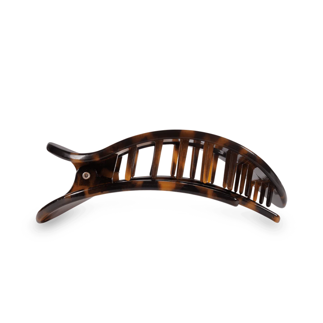 tortoise colored hair clip against white background