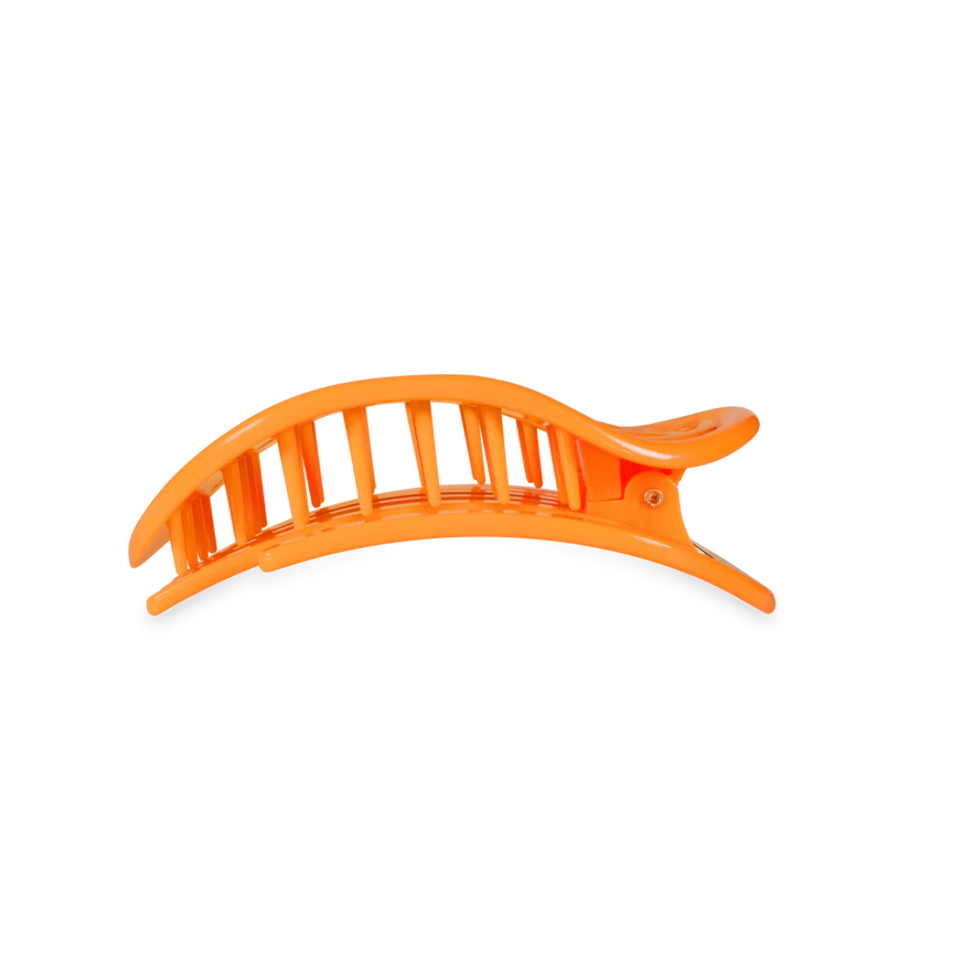 orange hairclip against white background