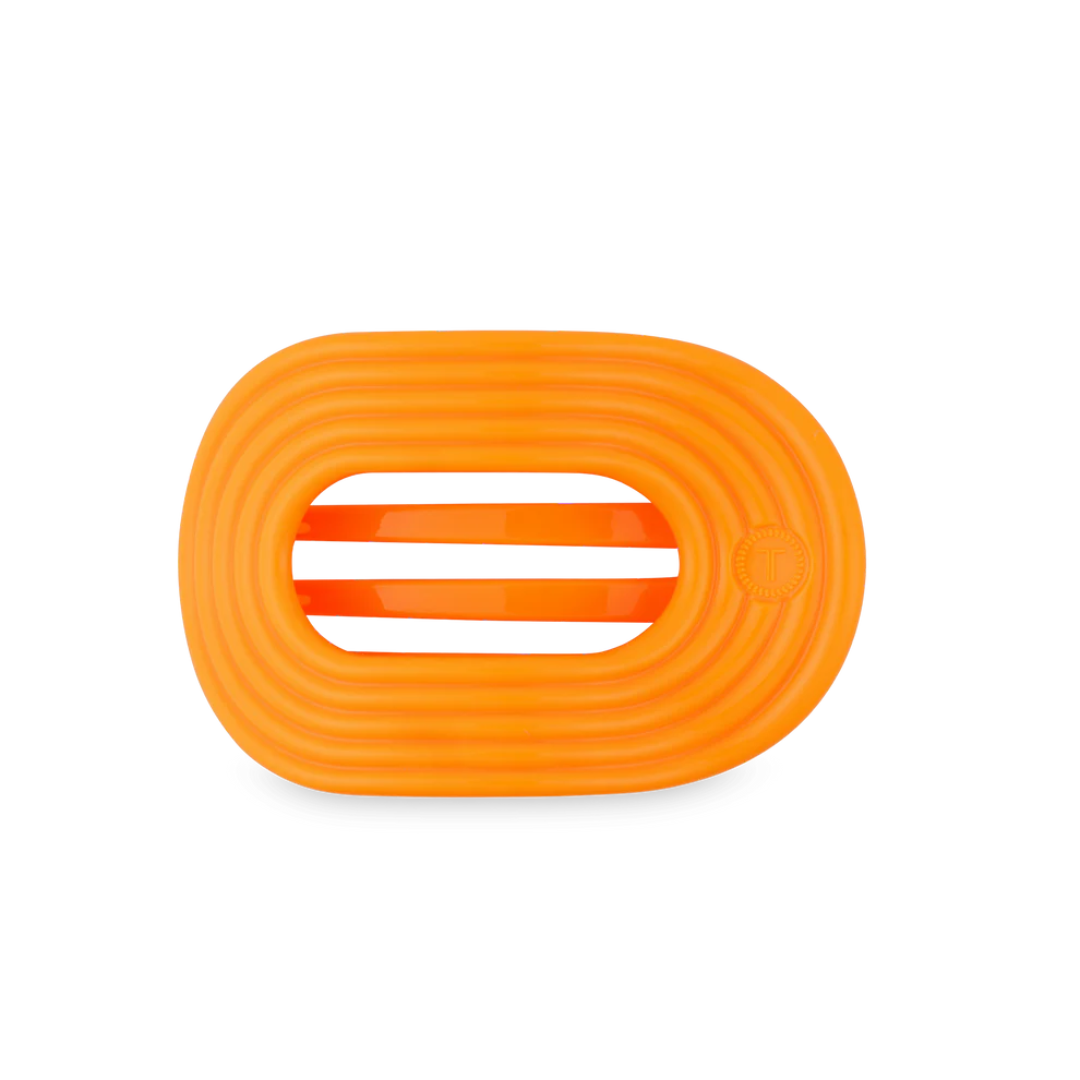 orange hairclip on white background